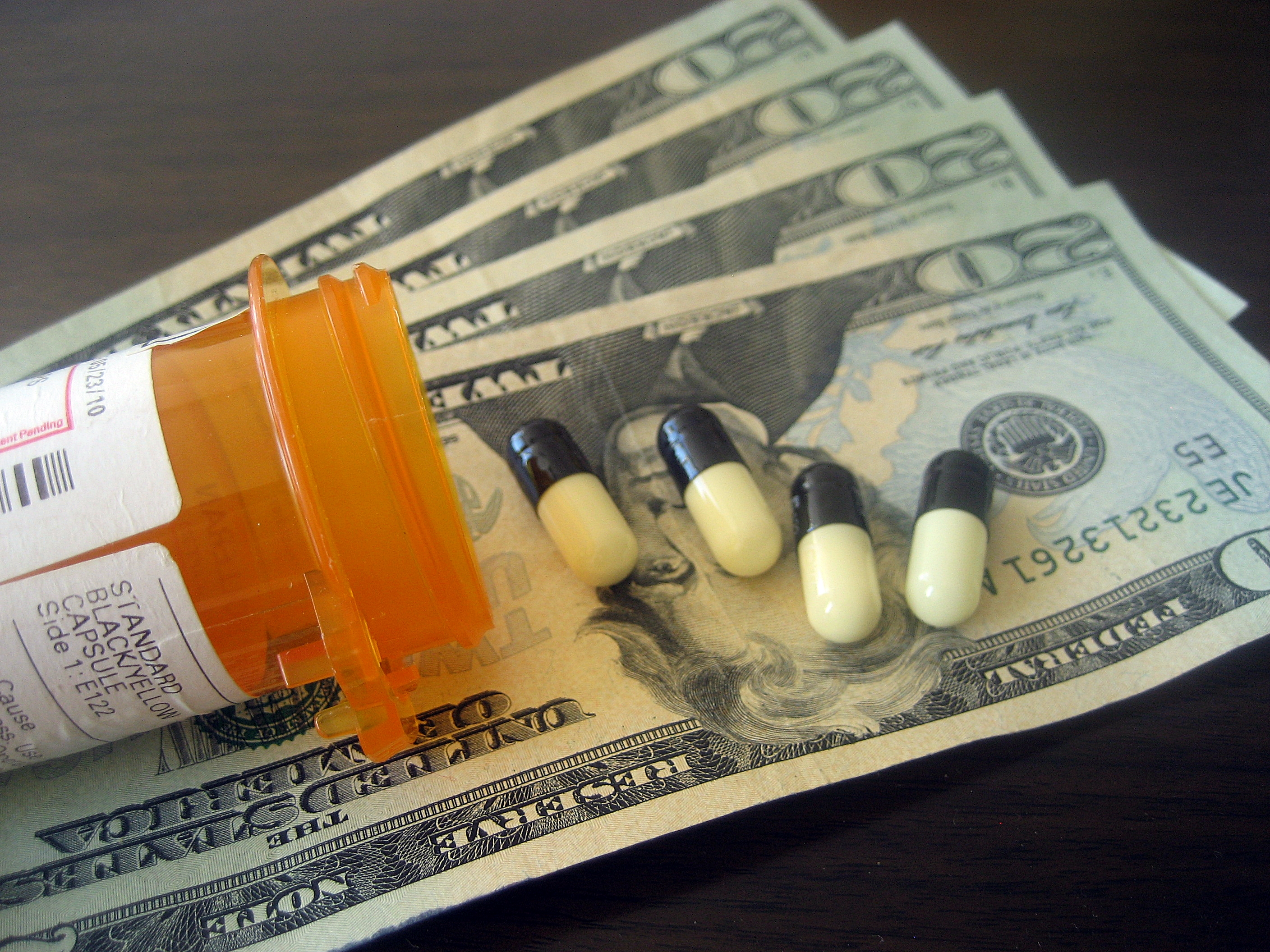Why are drug prices in the US twice as much as in Holland and Great Britain?
